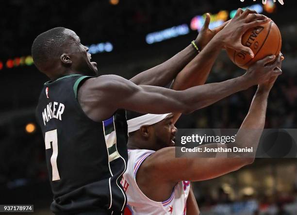 Thon Maker of the Milwaukee Bucks and Noah Vonleh of the Chicago Bulls battle for a rebound at the United Center on March 23, 2018 in Chicago,...