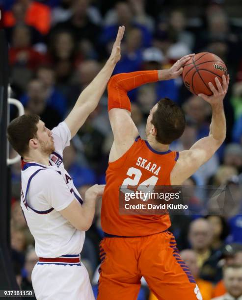 Kansas guard Sviatoslav Mykhailiuk trees to stop Clemson forward David Skara in the second half during the third round of the 2018 NCAA Photos via...