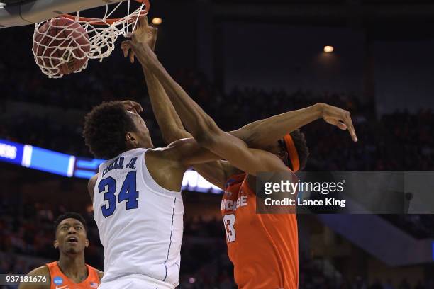 Paschal Chukwu of the Syracuse Orange dunks the ball against Wendell Carter, Jr. #34 of the Duke Blue Devils during the 2018 NCAA Men's Basketball...