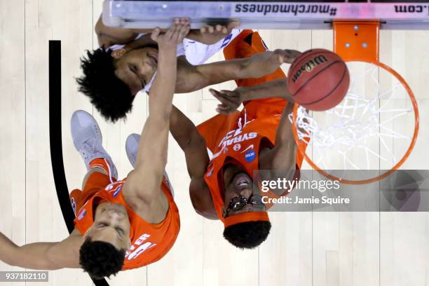 Marvin Bagley III of the Duke Blue Devils shoots the ball over Matthew Moyer and Paschal Chukwu of the Syracuse Orange during the first half in the...