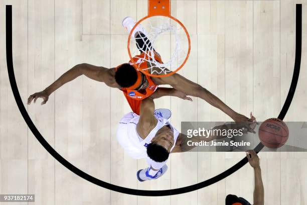 Paschal Chukwu of the Syracuse Orange defends Trevon Duval of the Duke Blue Devils during the first half in the 2018 NCAA Men's Basketball Tournament...