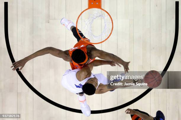 Paschal Chukwu of the Syracuse Orange defends Trevon Duval of the Duke Blue Devils during the first half in the 2018 NCAA Men's Basketball Tournament...