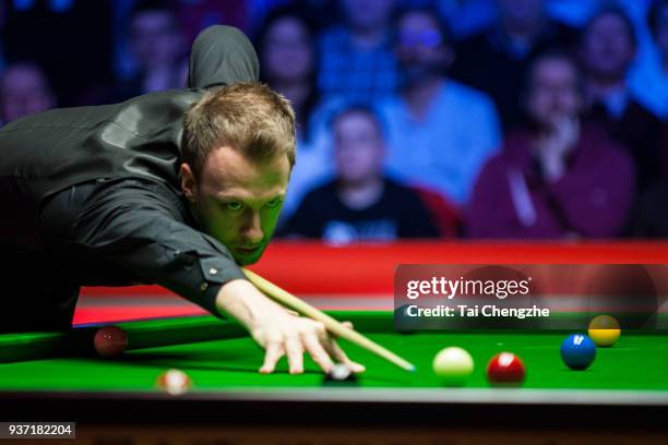 Judd Trump of England plays a shot during his semi-final match against Ronnie O'Sullivan of England on day five of 2018 Ladbrokes Players...