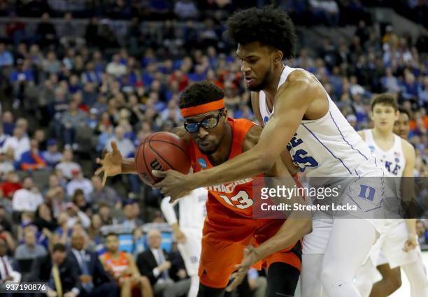 Paschal Chukwu of the Syracuse Orange fights for the ball against Marvin Bagley III of the Duke Blue Devils during the second half in the 2018 NCAA...