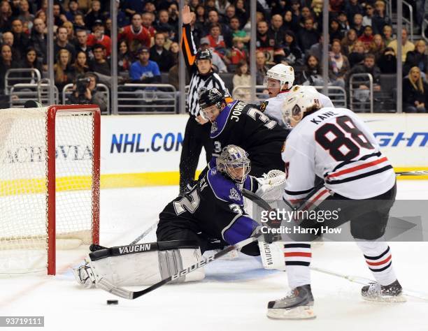 Patrick Kane of the Chicago Black Hawks misses a chance to score on Jonathan Quick of the Los Angeles Kings as Jack Johnson looks on during the game...