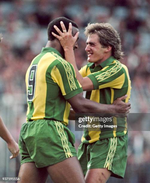 West Bromwich Albion striker Cyrille Regis and Gary Owen celebrate a goal during a First Divsion match against Brighton and Hove Albion at the...