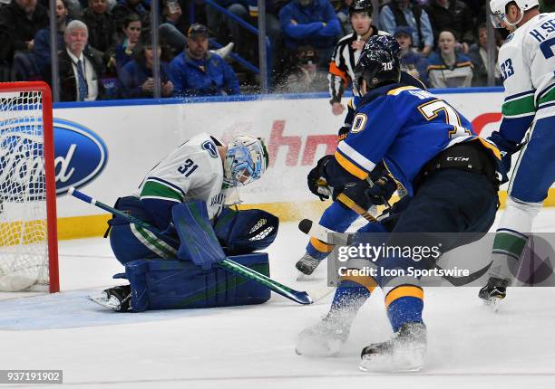 Vancouver Canucks goalie Anders Nilsson blocks a shot during a NHL game between the Vancouver Canucks and the St. Louis Blues on March 23 at...