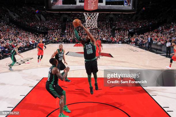 Jonathan Holmes of the Boston Celtics grabs the rebound against the Portland Trail Blazers on March 23, 2018 at the Moda Center in Portland, Oregon....