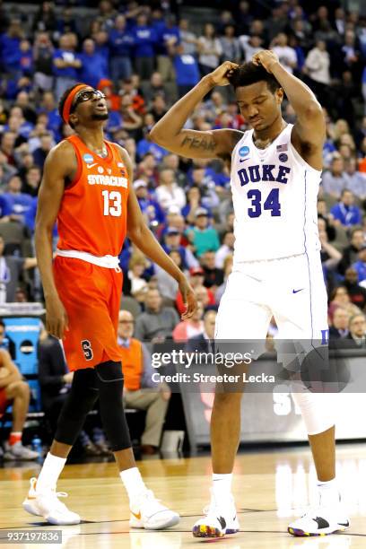 Paschal Chukwu of the Syracuse Orange and Wendell Carter Jr of the Duke Blue Devils react during the second half in the 2018 NCAA Men's Basketball...