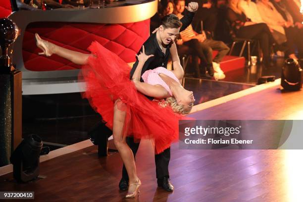 Heiko Lochmann and Kathrin Menzinger perform on stage during the 2nd show of the 11th season of the television competition 'Let's Dance' on March 23,...