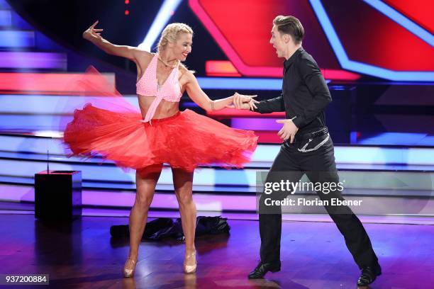 Heiko Lochmann and Kathrin Menzinger perform on stage during the 2nd show of the 11th season of the television competition 'Let's Dance' on March 23,...