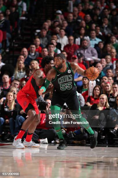 Jonathan Holmes of the Boston Celtics handles the ball against the Portland Trail Blazers on March 23, 2018 at the Moda Center in Portland, Oregon....
