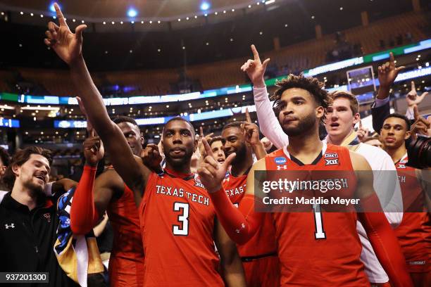 Josh Webster and Brandone Francis of the Texas Tech Red Raiders celebrate defeating the Purdue Boilermakers 78-65 in the 2018 NCAA Men's Basketball...