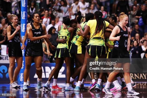 Jamaica celebrate after winning the Taini Jamison Trophy match between New Zealand and Jamaica at North Shore Events Centre on March 24, 2018 in...
