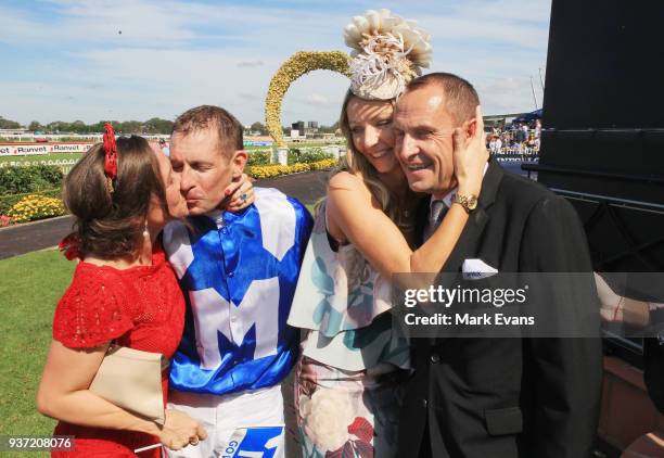 Christine Bowman kisses husband Hugh as Stephanie Waller hugs husband Chris after Winx won the George Ryder Stakesduring Golden Slipper Day at...