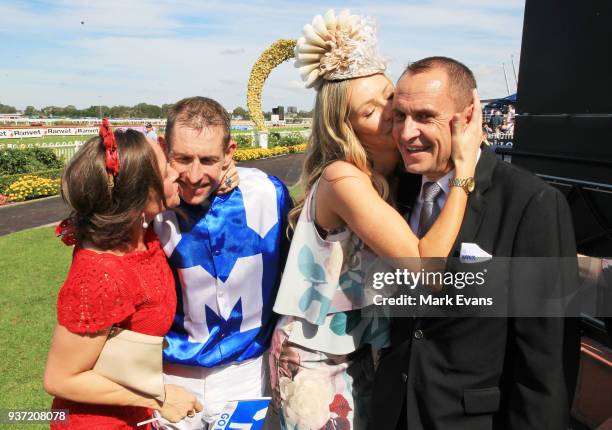 Christine Bowman kisses husband Hugh as Stephanie Waller kisses husband Chris after Winx won the George Ryder Stakesduring Golden Slipper Day at...