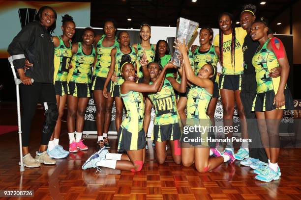 Jamaica celebrate after winning the Taini Jamison Trophy match between New Zealand and Jamaica at North Shore Events Centre on March 24, 2018 in...