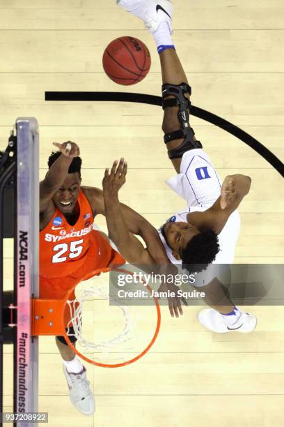 Tyus Battle of the Syracuse Orange attempts a lay up against Marques Bolden of the Duke Blue Devils in the 2018 NCAA Men's Basketball Tournament...