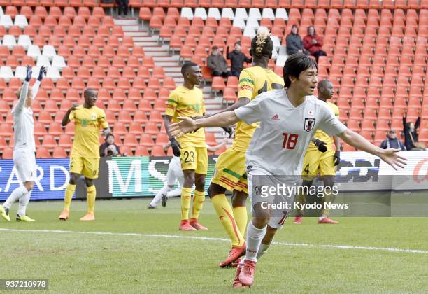 Shoya Nakajima of Japan celebrates after scoring a last-minute equalizer to earn a 1-1 draw with Mali in a football friendly in Liege, Belgium, on...