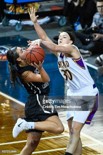 Andi Daugherty of Ashland University blocks a layup attempt by Megan Skaggs of the University of Central Missouri during the Division II Women's...