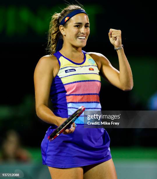 Monica Puig of Puerto Rico celebrates beating Caroline Wozniacki of Denmark 0-6 6-4 6-4 during Day 5 of the Miami Open Presented by Itau at Crandon...