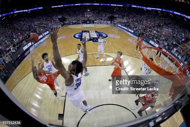 Tyus Battle of the Syracuse Orange shoots the ball over Wendell Carter Jr of the Duke Blue Devils in the 2018 NCAA Men's Basketball Tournament...