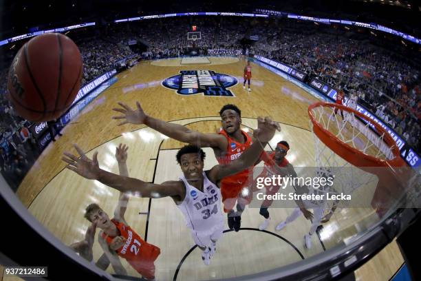 Wendell Carter Jr of the Duke Blue Devils looks for the rebound against Oshae Brissett of the Syracuse Orange in the 2018 NCAA Men's Basketball...