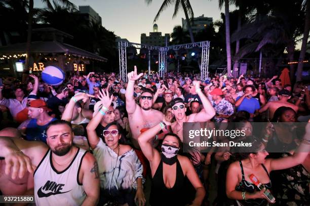 Guests dance to DJ music during the Chuckie & Friends Party hosted by 93.5FM Revolution Radio Miami as part of Miami Music Week at the National Hotel...