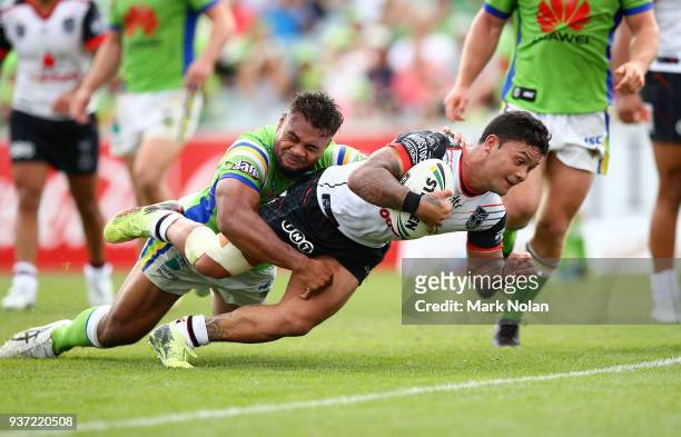 Issac Luke of the Warriors crosses the line to score during the round three NRL match between the Canberra Raiders and the New Zealand Warriors at...