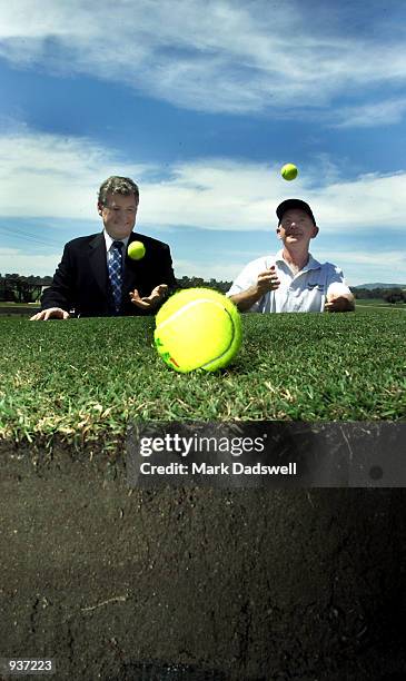 Geoff Pollard, President of Tennis Australia and Joe McCullagh, Project Mgr for StrathAyr inspect a section of the grass court to be used for the...