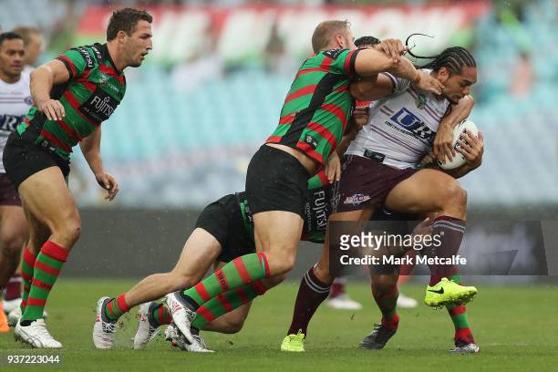 Martin Taupau of the Sea Eagles is tackled during the round three NRL match between the South Sydney Rabbitohs and the Manly Sea Eagles at ANZ...