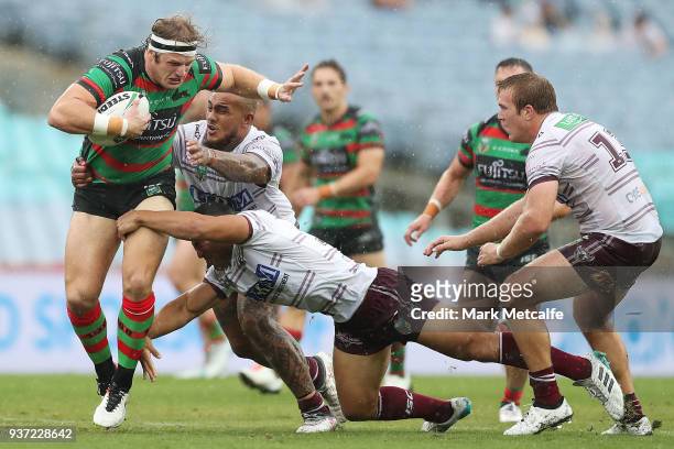 George Burgess of the Rabbitohs is tackled during the round three NRL match between the South Sydney Rabbitohs and the Manly Sea Eagles at ANZ...