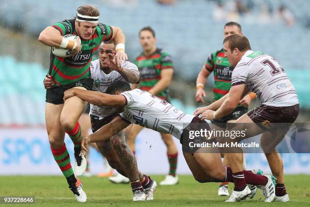 George Burgess of the Rabbitohs is tackled during the round three NRL match between the South Sydney Rabbitohs and the Manly Sea Eagles at ANZ...