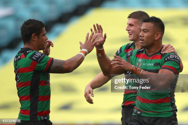 Richie Kennar of the Rabbitohs celebrates a try with team mates during the round three NRL match between the South Sydney Rabbitohs and the Manly Sea...