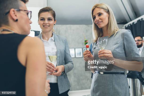 business conference and event - chat canapé stock pictures, royalty-free photos & images