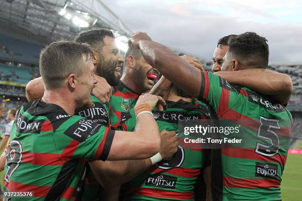 Rabbitohs players celebrate a try during the round three NRL match between the South Sydney Rabbitohs and the Manly Sea Eagles at ANZ Stadium on...