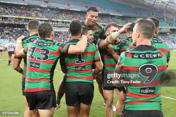 Rabbitohs players celebrate a try during the round three NRL match between the South Sydney Rabbitohs and the Manly Sea Eagles at ANZ Stadium on...