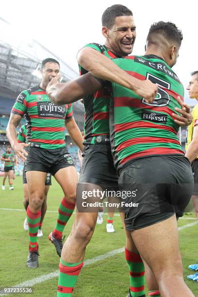 Robert Jennings of the Rabbitohs scores a try and celebrates with a team mate during the round three NRL match between the South Sydney Rabbitohs and...