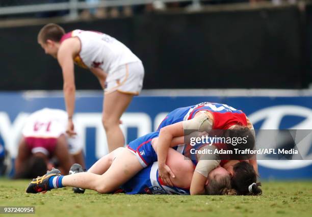 Bulldogs players Kirsty Lamb, Emma Kearney and Aisling Utri celebrate on the final siren during the 2018 AFLW Grand Final match between the Western...