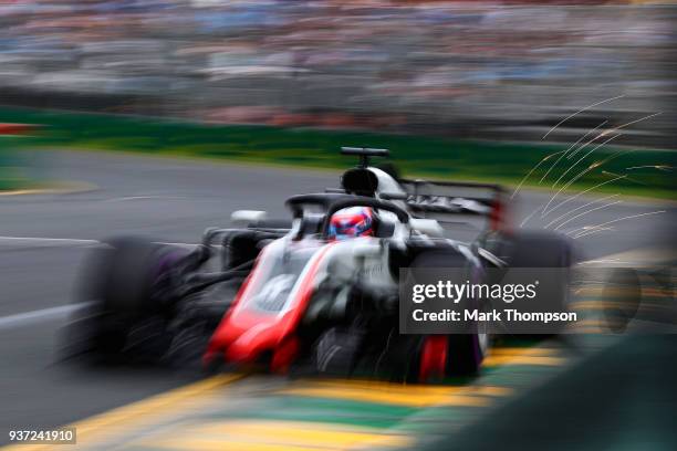 Sparks fly behind Romain Grosjean of France driving the Haas F1 Team VF-18 Ferrari on track during qualifying for the Australian Formula One Grand...