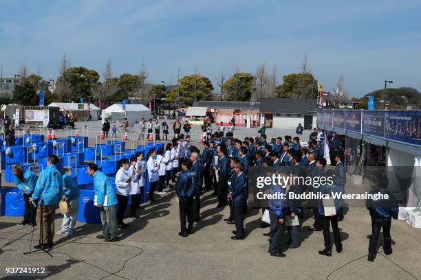 The judgers stand during the 35th annual Nishikigoi All Japan Young Koi Show at Otemae Park on March 24, 2018 in Himeji, Japan. Approximately 1500...