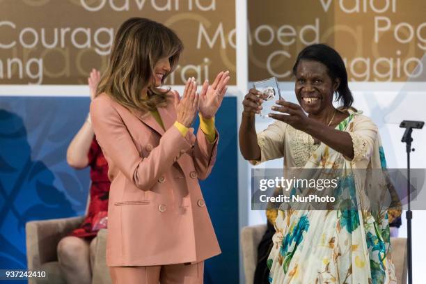 First Lady Melania Trump stands by, as Godelieve Mukasarasi of Rwanda, Founder and Coordinator of the organization Solidarité pour l'Épanouissement...