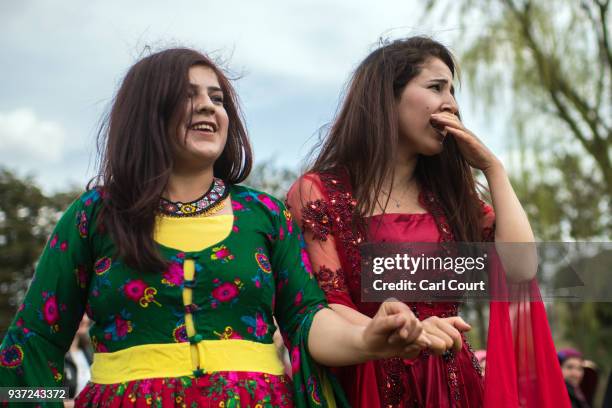 Kurdish woman ululates as she dances with a friend during Nowruz celebrations on March 24, 2018 in Tokyo, Japan. Nowruz meaning 'new day' and marking...