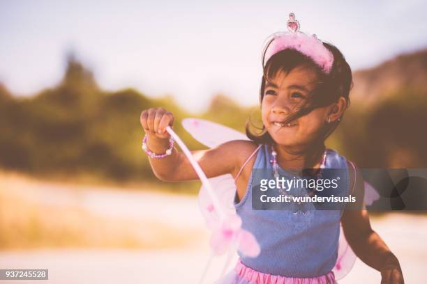 little asian girl playing outdoors dressed as a fairy queen - the fairy queen stock pictures, royalty-free photos & images