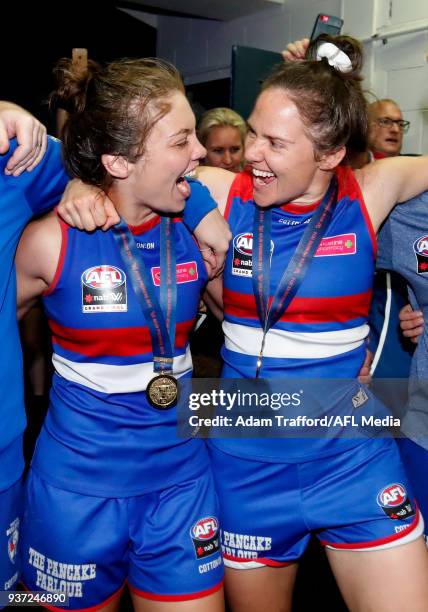 Ellie Blackburn and Emma Kearney of the Bulldogs sing the team song during the 2018 AFLW Grand Final match between the Western Bulldogs and the...