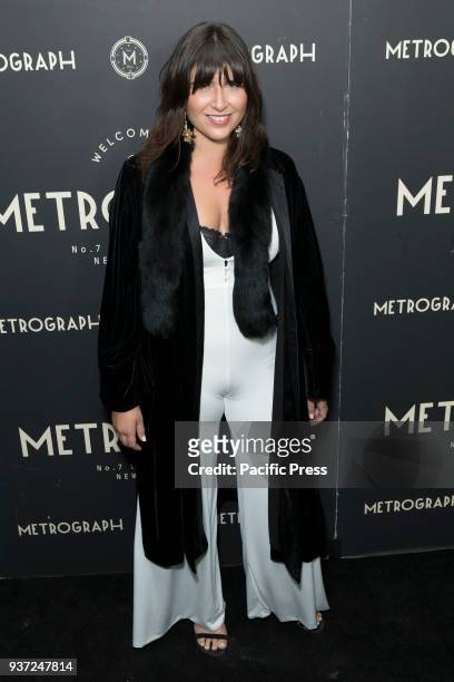 Emily Warren wearing coat by Elizabeth and James and jumpsuit by House of London attends Metrograph 2nd Anniversary party at Metrograph.