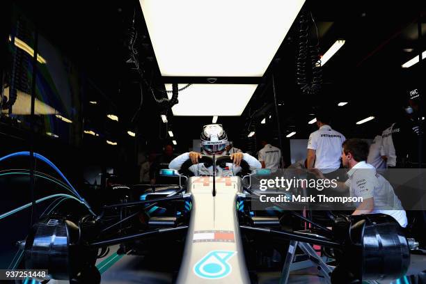 Lewis Hamilton of Great Britain and Mercedes GP prepares to drive in the garage during final practice for the Australian Formula One Grand Prix at...