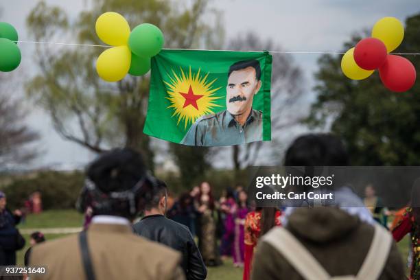 Flag bearing a picture of Abdullah Ocalan, the founder and leader of the Kurdistan Workers' Party , is displayed during Nowruz celebrations on March...