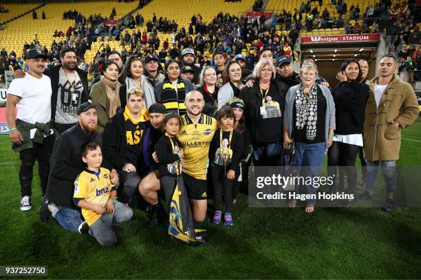 Perenara of the Hurricanes poses with family and friends after his 100th game during the round six Super Rugby match between the Hurricanes and the...