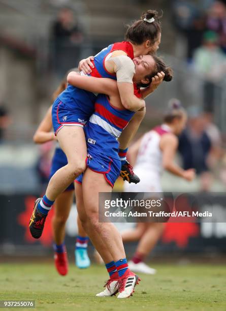 Emma Kearney of the Bulldogs celebrates a goal with Ellie Blackburn of the Bulldogs during the 2018 AFLW Grand Final match between the Western...
